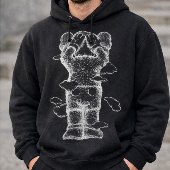 KAWS: Holiday Hoodie – Black Graphic Sweatshirt (United Kingdom Edition)